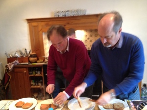Martin is at the stove behind Vic and Chris, who are calmly assembling plates - impressive, no?
